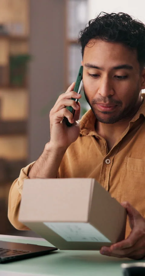 Logistics, man and phone call with box in startup for shipping enquiry, order Stock Footage 337474148