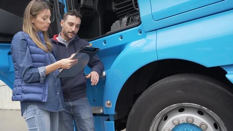 Logistics manager controlling truck driver schedule Stock Footage