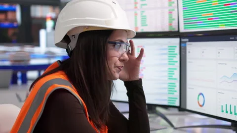 Logistics Manager Monitors Warehouse Packages On Computer, Looking Tired Stock Footage 337640919