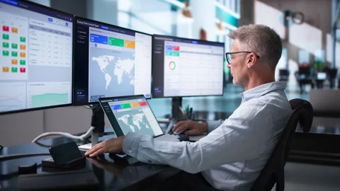 Logistics Manager Uses Laptop To Track Global Shipment Stock Footage 343883569