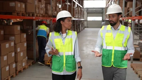 Logistics managers walking through warehouse Stock Footage 161947771