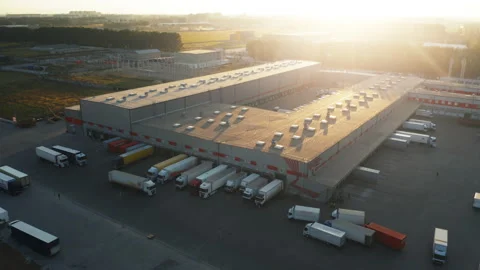 Logistics park with warehouse and loading hub. Semi-trailers trucks at ramps Video stock 154918674