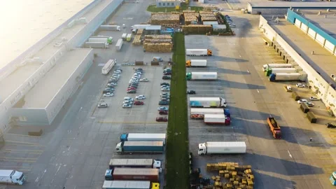 Logistics park with a warehouse - loading hub. Semi-trucks with freight trailers Stock Footage