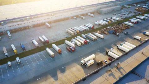 Logistics park with a warehouse - loading hub. Semi-trucks with freight trailers Stock Footage