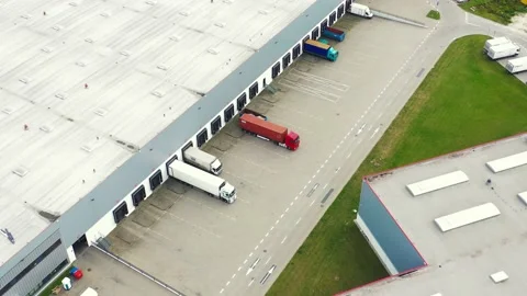 Logistics park with warehouses, loading hub and a lot of semi-trailer trucks  Stock Footage 145536446