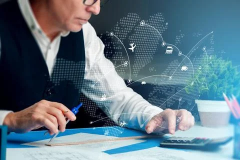 Logistics professional uses tools to plan transport and supply chain operations Stock Photos