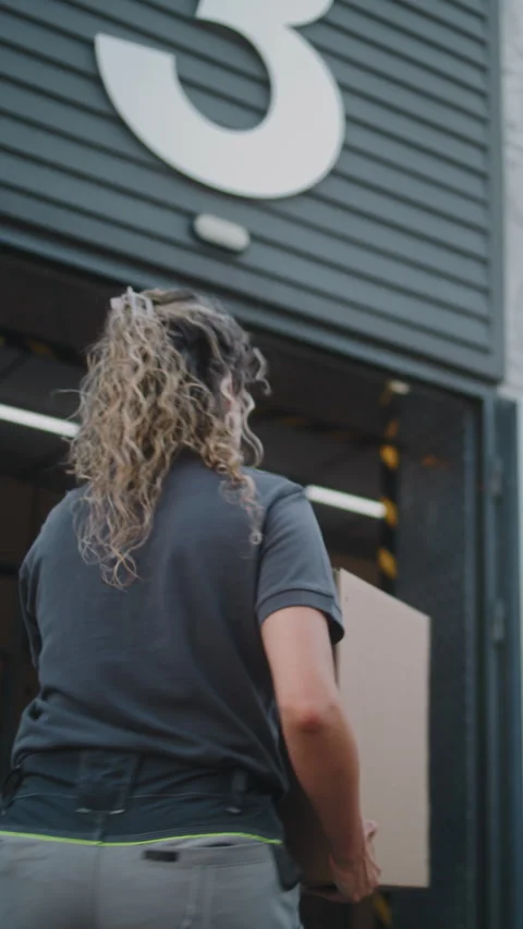 Logistics Retail Warehouse: Female Worker Taking Cardboard Box from Colleague Vídeo Stock 312274565