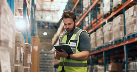 Logistics, tablet and man in warehouse with inspection for stock control, i.. Stockfoto's