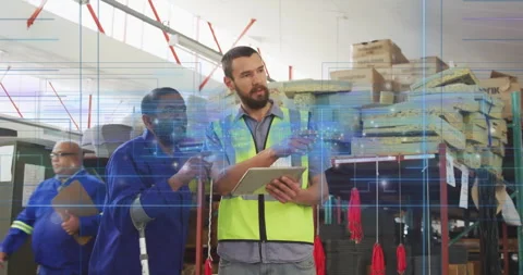 Logistics team examining digital inventory data on tablet in storage area, with Stock Footage 309110630