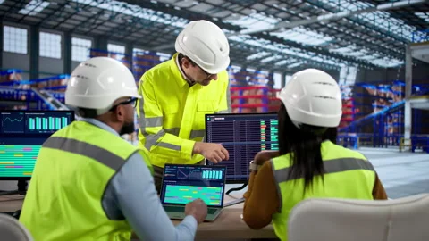 Logistics Team Meeting In Warehouse Using Computers Stock Footage 330584036
