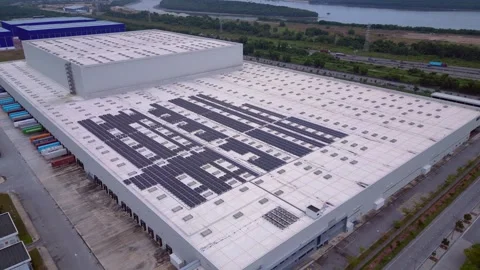 Logistics warehouse building, solar panels on roof. Majestic aerial view drone Stock Footage 344601769