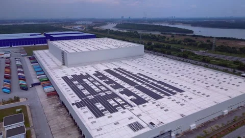 Logistics warehouse building, solar panels on roof. Magic aerial view drone Stock Footage 344610685