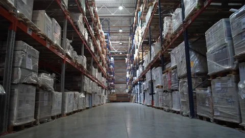Logistics warehouse. Camera in motion. On the shelves are flying with goods. 4K Stock-Footage 111766674