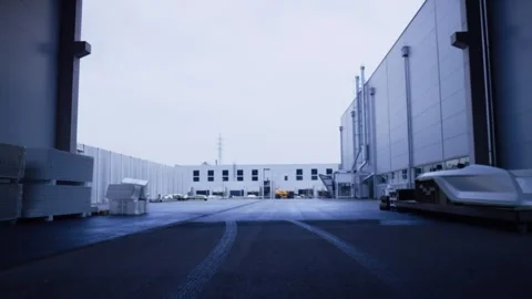 Logistics Warehouse Exterior with Empty Yard, Industrial Estate, Wide Shot Stock Footage 340331678
