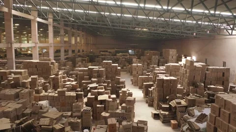 Logistics warehouse filled with towering stacks of cardboard boxes Stock Footage 327544938
