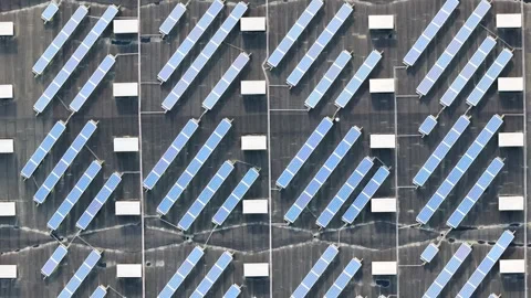 Logistics warehouse roof diagonal rows blue photovoltaic panels rectangular Stock Footage 329091373