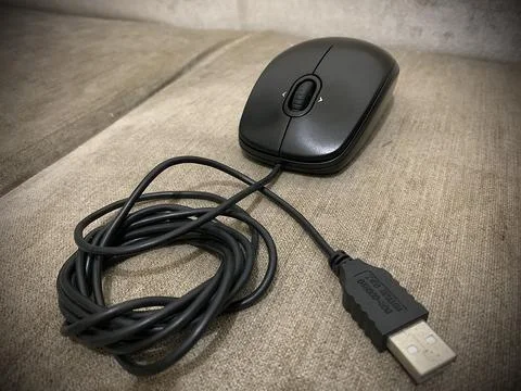 Logitech USB mouse on sofa Stock Photos