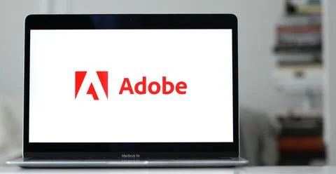 Logo of Adobe, an American computer software corporation on a laptop display Stock Photos