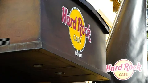 Logo on the external façade of Rome's hard rock cafe. thematic restaurant Stock Footage 117069999