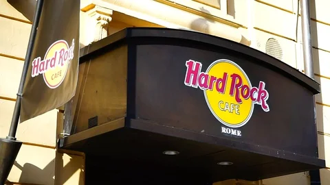 Logo on the external façade of Rome's hard rock cafe. thematic restaurant Stock Footage 117070003