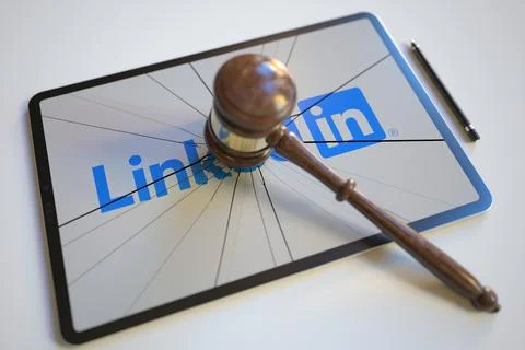 Logo of LINKEDIN on the tablet computer screen hit by judge's gavel. Court Stock-Illustration