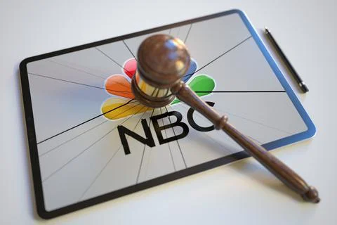 Logo of NBC on the tablet computer screen hit by judge's gavel. Court related Stock-Illustration
