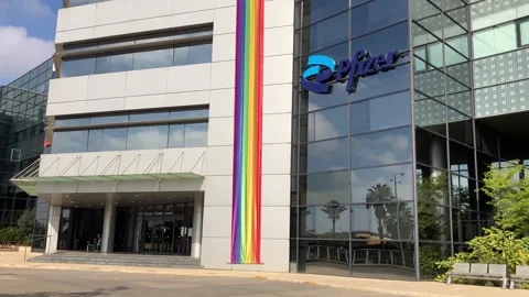 Logo Pfizer Inc. on building facade Stock Footage 244981864