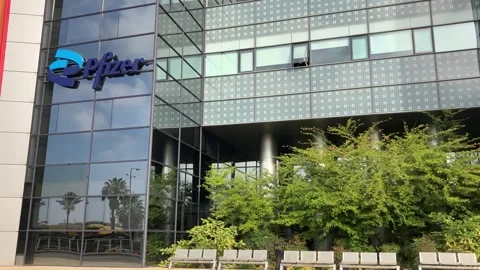 Logo Pfizer Inc. on building facade Stock Footage 244981873