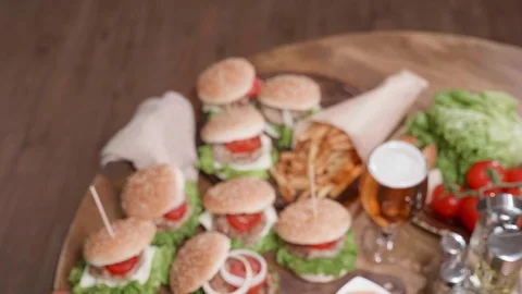 Logo shot camera movement from above showing a plateau of burgers Stock Footage 104253046