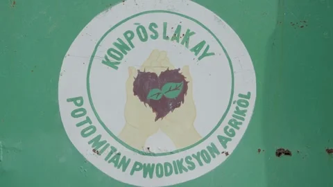 Logo of SOIL compost project in Haiti. Close-up Stock Footage 325717239