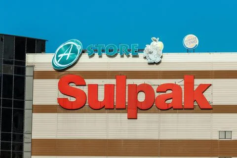 The logo of Sulpak and A Store on the building of a shopping and entertainment Stock Photos