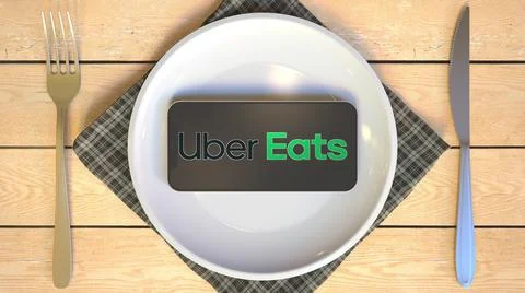 Logo of UBER EATS on the display of smartphone on the plate. Editorial food or Illustrazione stock