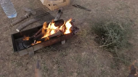 Logs are burning in the camping brazier. Stock Footage 159238320