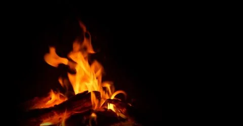 Logs burning fire on black background 스톡 사진