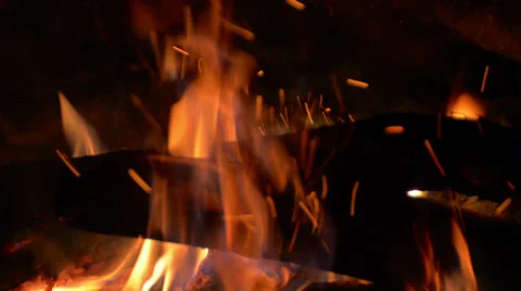 Logs burning in fire at night tracking right Video stock 38059766