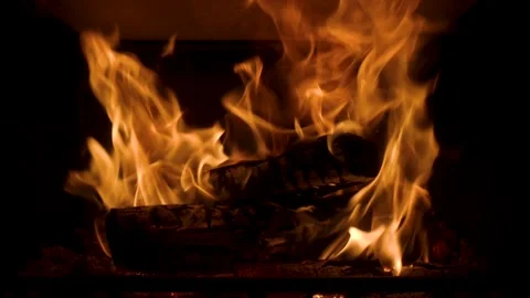 Logs burning in a fireplace in slow motion Stock Footage 235020155