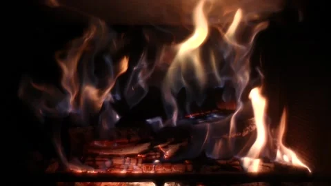 Logs burning in a fireplace in slow motion Video stock 235020195