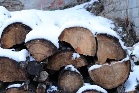 Logs covered by snow Stock Photos