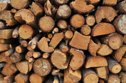 Logs of firewood in a nice stack, all piled up together. Stock Photos