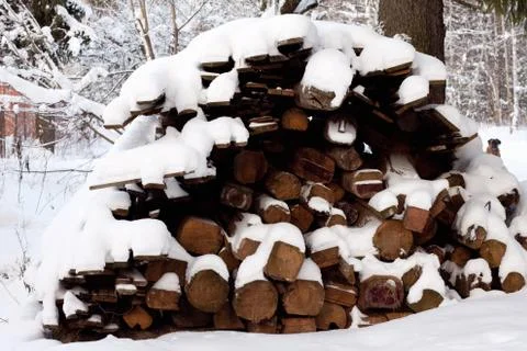 Logs under snow Stock Photos