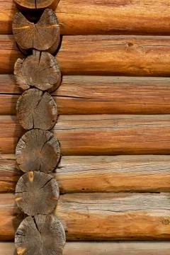 Logs of the wall of an ancient building as a texture or backdrop, vertical fr Fotos de archivo