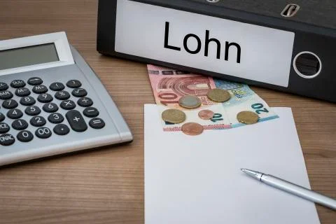 Lohn written on a binder Stock Photos