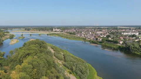 The Loire River winding through the lush green landscape near Sully-sur-Loire Stock Footage 346720040