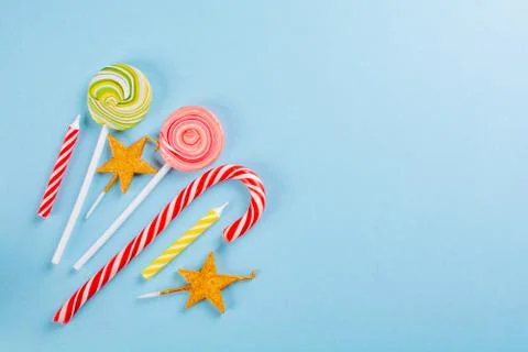 Lolipops on blue background Stock Photos