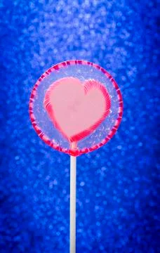 Lollipop on glitter Stock Photos