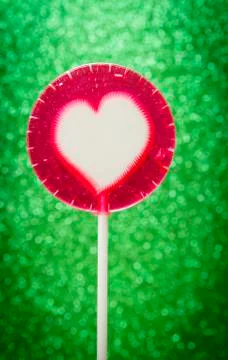 Lollipop on glitter Stock Photos