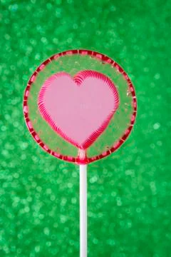 Lollipop on glitter Stock Photos