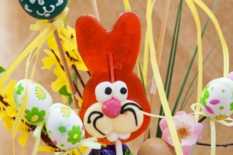 Lollipop-shaped easter bunny with eggs Stock Photos