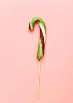Lollipops, candy cane, top view flat lay on colorful background Stock Photos