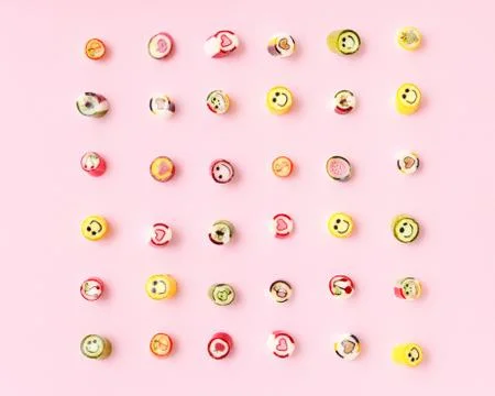 Lollipops, candy pattern, top view flat lay on colorful background Stock Photos